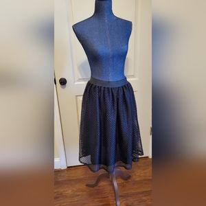 A line fluttery black skirt